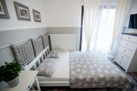 Łóżko lub łóżka w pokoju w obiekcie Apartamenty Królewska Kwatera