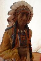 a wooden statue of a woman wearing an indian headdress at Levaltipis in Saint Gatien des Bois