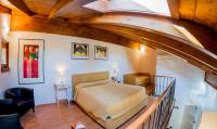A bed or beds in a room at Il Borgo