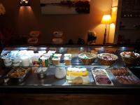 a buffet with different types of food on a table at Logis Hotel Restaurant la Ferme in Avignon