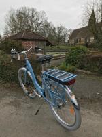 a blue bike parked on the side of a road at Chambres d&#39;hôtes Saint Jean in Nogent-le-Rotrou