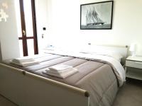 Posteľ alebo postele v izbe v ubytovaní GoodStay Casa Tati
