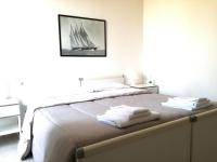 Posteľ alebo postele v izbe v ubytovaní GoodStay Casa Tati