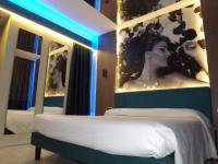 Posteľ alebo postele v izbe v ubytovaní Hotel Camelia