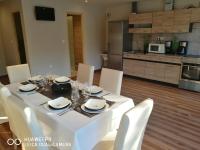 A kitchen or kitchenette at Room4U Apartment