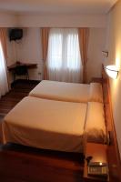 Postel nebo postele na pokoji v ubytování Hotel Sindika