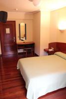 Postel nebo postele na pokoji v ubytování Hotel Sindika