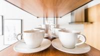 Zestaw do parzenia kawy i herbaty w obiekcie Super-Apartamenty Exclusive