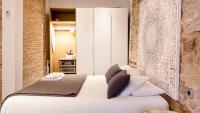 Postel nebo postele na pokoji v ubytování Ferreries Boutique Apartment