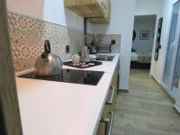 Kuchyňa alebo kuchynka v ubytovaní Living Sevilla Apartments Hércules