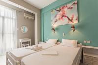 Posteľ alebo postele v izbe v ubytovaní Protopapas Rooms