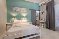 Posteľ alebo postele v izbe v ubytovaní Protopapas Rooms