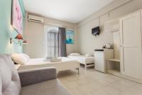 Posteľ alebo postele v izbe v ubytovaní Protopapas Rooms