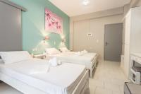 Posteľ alebo postele v izbe v ubytovaní Protopapas Rooms