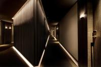 a dark hallway with a row of lights at Olivia Balmes Hotel in Barcelona