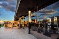 a group of people walking in a building with windows at Olivia Balmes Hotel in Barcelona