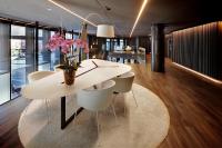 a dining room with a white table and chairs at Olivia Balmes Hotel in Barcelona