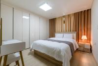 Home Fourest Residence Hotel Okpoにあるベッド