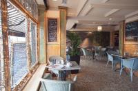 a dining room with tables and chairs in a restaurant at Arlington Hotel O'Connell Bridge in Dublin