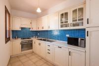 A kitchen or kitchenette at Apartment in S'Abba e Sa Pedra with pool