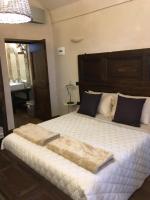 Łóżko lub łóżka w pokoju w obiekcie Corte degli Angeli Agriturismo