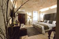 Łóżko lub łóżka w pokoju w obiekcie Corte degli Angeli Agriturismo