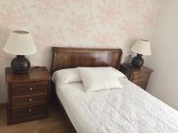 A bed or beds in a room at Hotel Rural Nova Ruta