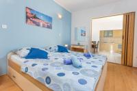 Posteľ alebo postele v izbe v ubytovaní Apartments Ivanović
