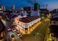 a city street with cars parked in front of a building at Hutton Central Hotel Managed by The Ascott Limited in George Town