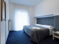 Łóżko lub łóżka w pokoju w obiekcie Hotel Rubino