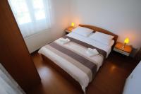 Posteľ alebo postele v izbe v ubytovaní Apartmani Svemir
