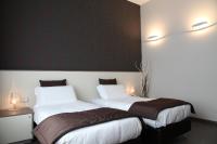 Łóżko lub łóżka w pokoju w obiekcie Hotel Tiziano - Gruppo Mini Hotel