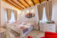 A bed or beds in a room at VILLA GIUMMARITO B&B