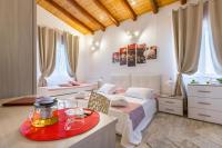 A bed or beds in a room at VILLA GIUMMARITO B&B