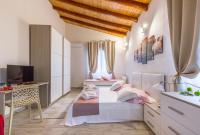A bed or beds in a room at VILLA GIUMMARITO B&B