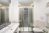 a bathroom with a shower and a toilet and a sink at Hotel Nice in Sorrento
