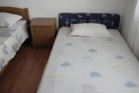 Postel nebo postele na pokoji v ubytování Apartmani Huljev