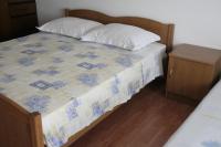 Postel nebo postele na pokoji v ubytování Apartmani Huljev
