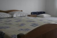 Postel nebo postele na pokoji v ubytování Apartmani Huljev