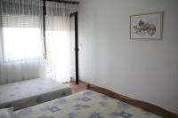 Postel nebo postele na pokoji v ubytování Apartmani Huljev