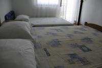 Postel nebo postele na pokoji v ubytování Apartmani Huljev