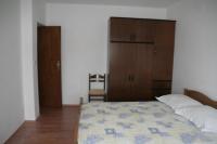 Postel nebo postele na pokoji v ubytování Apartmani Huljev