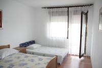 Postel nebo postele na pokoji v ubytování Apartmani Huljev