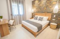 A bed or beds in a room at Αngelikon Luxurious Apartments