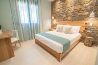 A bed or beds in a room at Αngelikon Luxurious Apartments