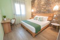 A bed or beds in a room at Αngelikon Luxurious Apartments
