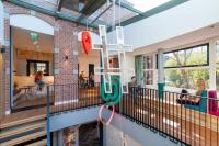 a view of the inside of a school building with a playground at Stayokay Hostel Amsterdam Vondelpark in Amsterdam