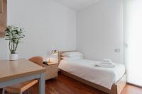A bed or beds in a room at Camplus Lambrate Casa per Ferie