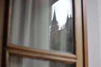 a reflection of a church in a glass window at Casa Rural Priena in Covadonga