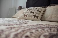 A bed or beds in a room at Via Vittorio Emanuele Apartment